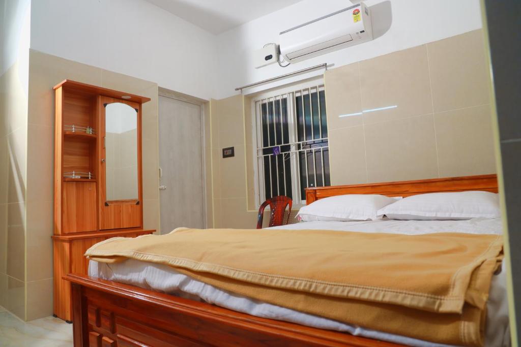 Postel nebo postele na pokoji v ubytování Lily Homestay