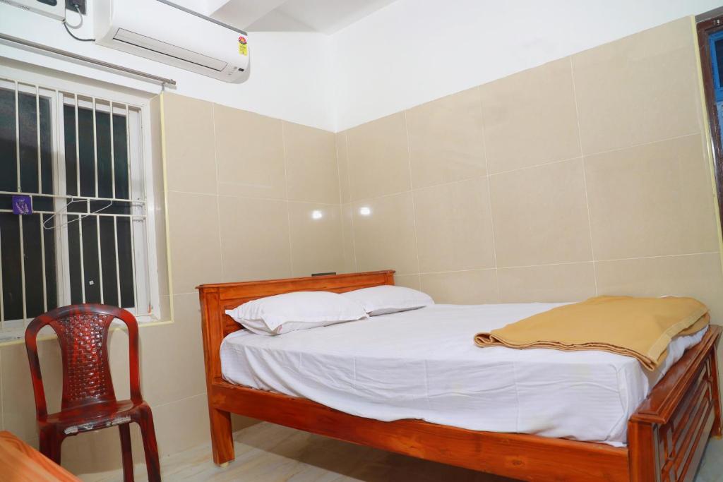 Postel nebo postele na pokoji v ubytování Lily Homestay