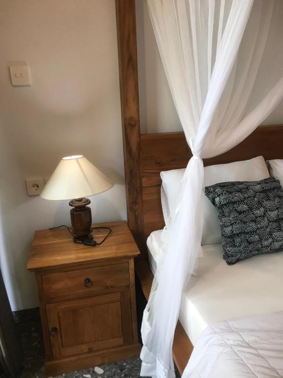 Letto o letti in una camera di GUS ARDITYA HOMESTAY