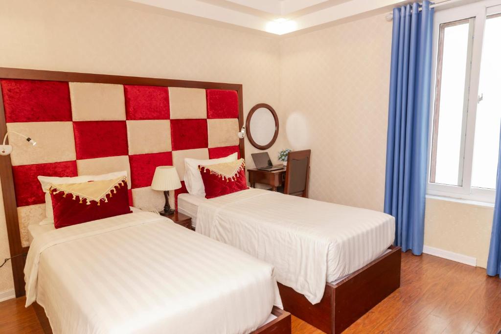 Postel nebo postele na pokoji v ubytování Hanoi City Backpackers Hostel