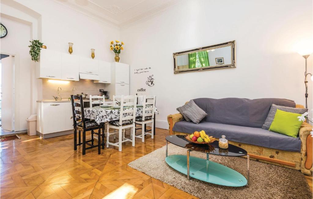 a living room with a couch and a table at Beautiful Apartment In Rijeka With Wifi in Rijeka