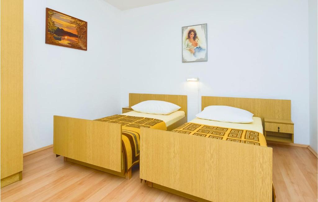 Posteľ alebo postele v izbe v ubytovaní Four-Bedroom Apartment In Omis