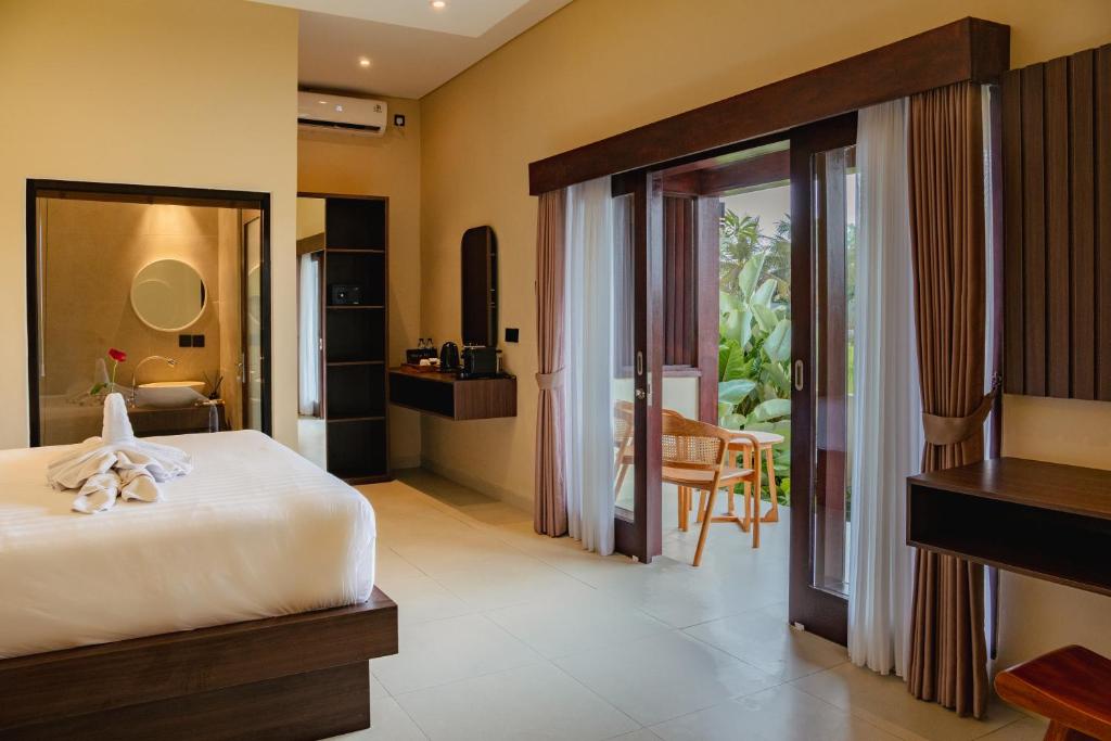 Postel nebo postele na pokoji v ubytování Tut Winten Villa Ubud