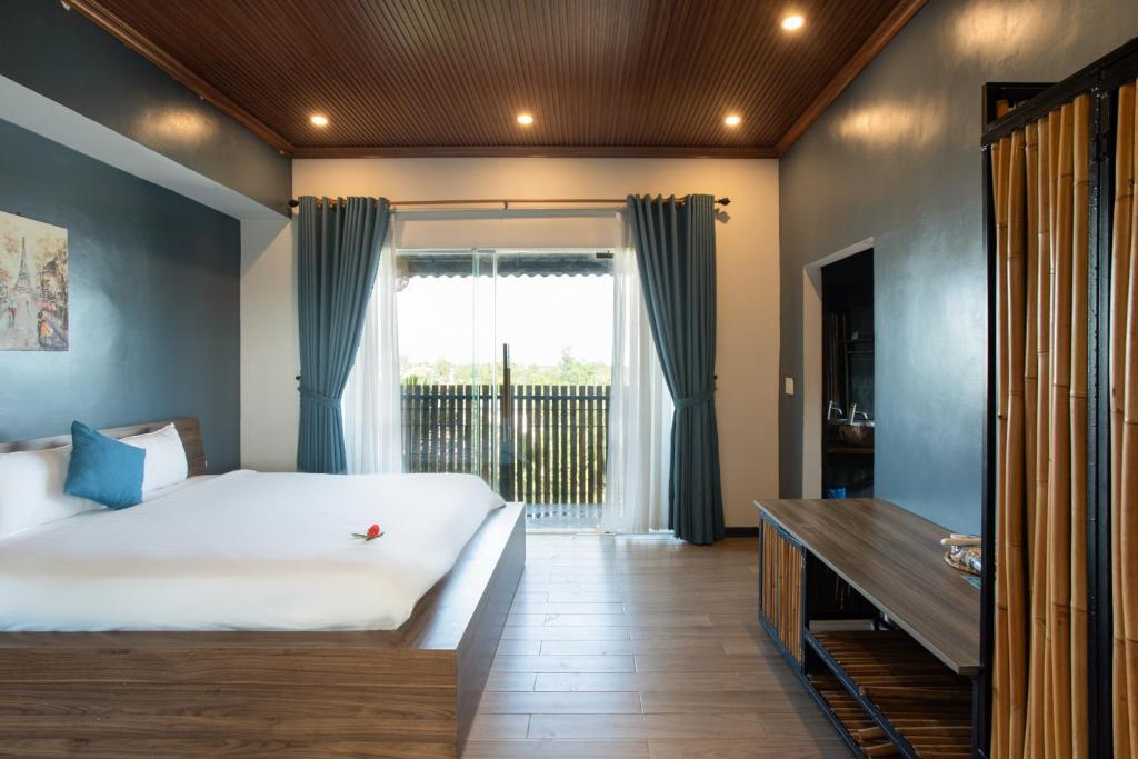 Postel nebo postele na pokoji v ubytování Phúc Villa Hoi An