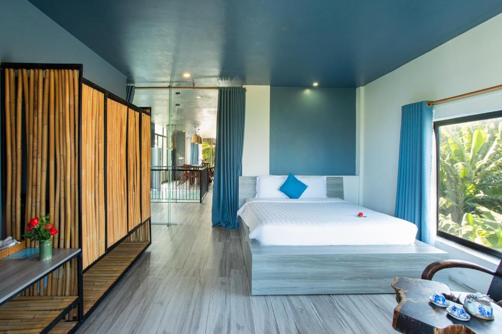 Postel nebo postele na pokoji v ubytování Phúc Villa Hoi An