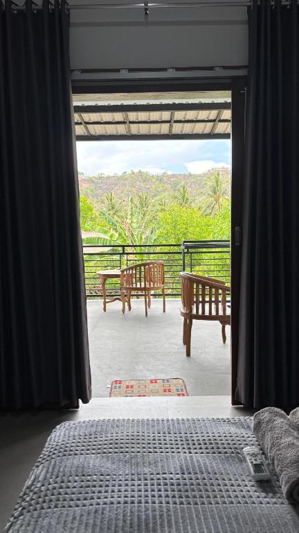 Postel nebo postele na pokoji v ubytování Cewin's Homestay