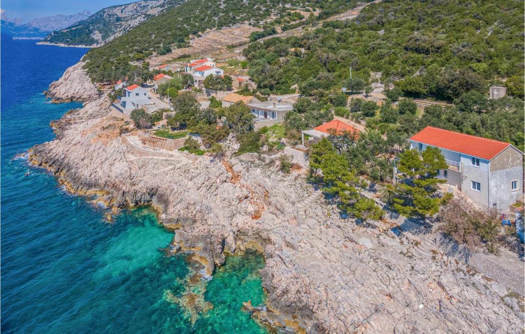 an aerial view of a house on a rocky island at Awesome Home In Potomje With Wifi in Potomje