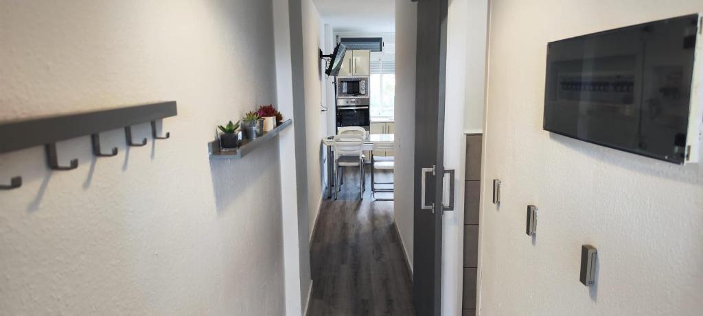 Televízia a/alebo spoločenská miestnosť v ubytovaní Apartment Molinos Relax