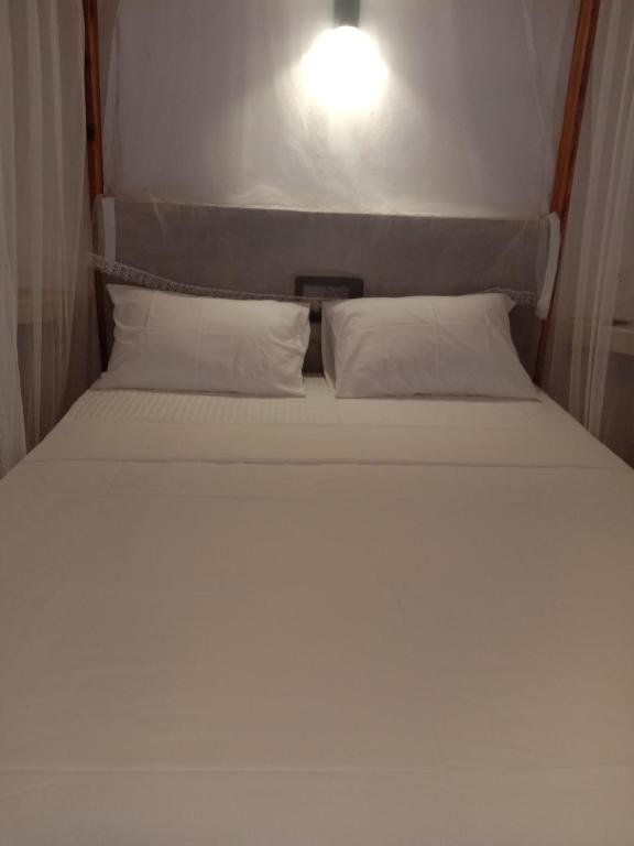 Postel nebo postele na pokoji v ubytování Chameera guest house