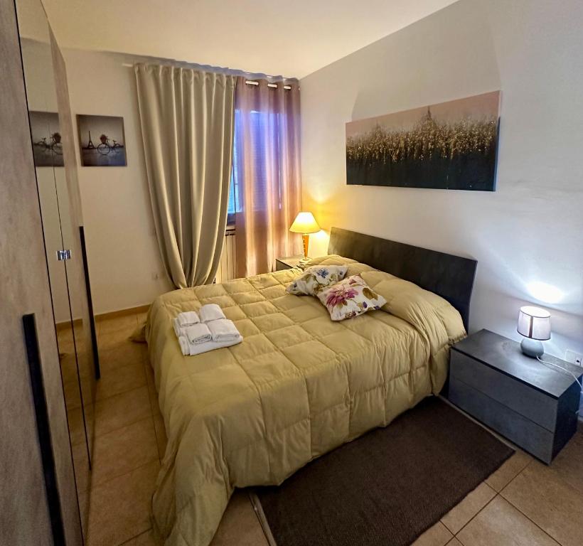 Postel nebo postele na pokoji v ubytování Casa vacanze Giuliani via Rasiglia