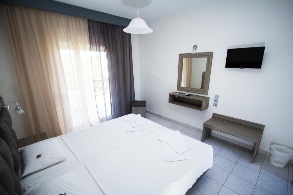 Postel nebo postele na pokoji v ubytování Hotel Maria