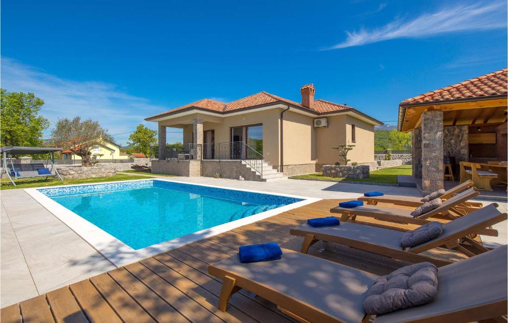 a swimming pool in a backyard with a house at Nice Home In Soboli, Cavle With Sauna in Soboli
