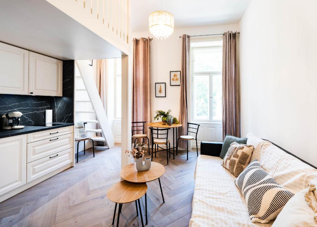a living room with a couch and a table at Silvie Apartments - Vídeňská in Olomouc