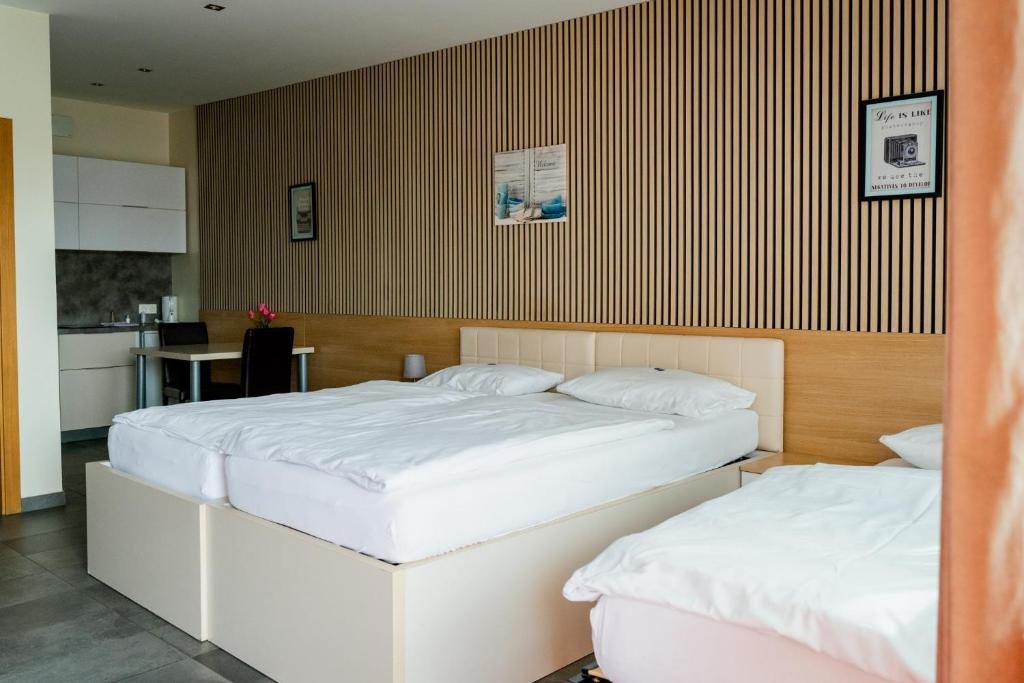 Postel nebo postele na pokoji v ubytování Nava Motel SELF CHECK-IN