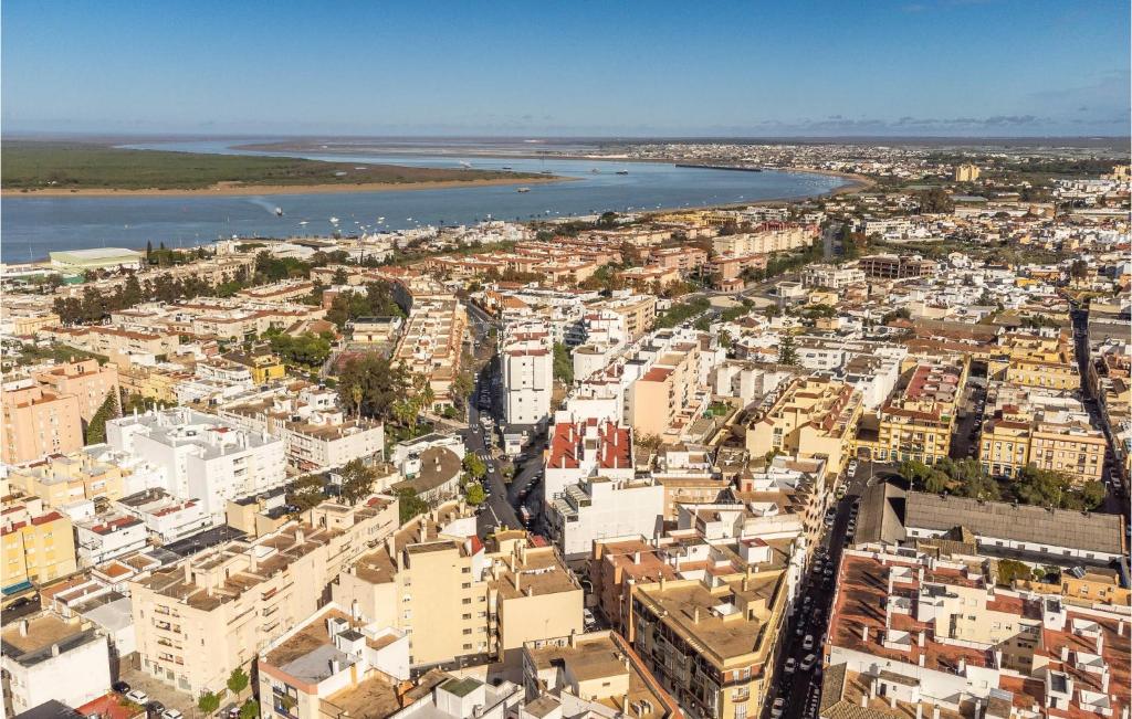 an aerial view of a city with a river and buildings at Cozy Apartment In Sanlúcar De Barrameda in Sanlúcar de Barrameda