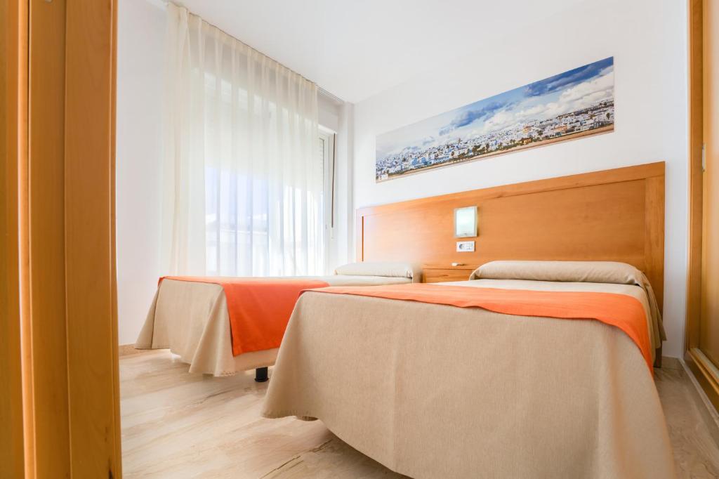Postel nebo postele na pokoji v ubytování Hotel Apartamentos Loto Conil