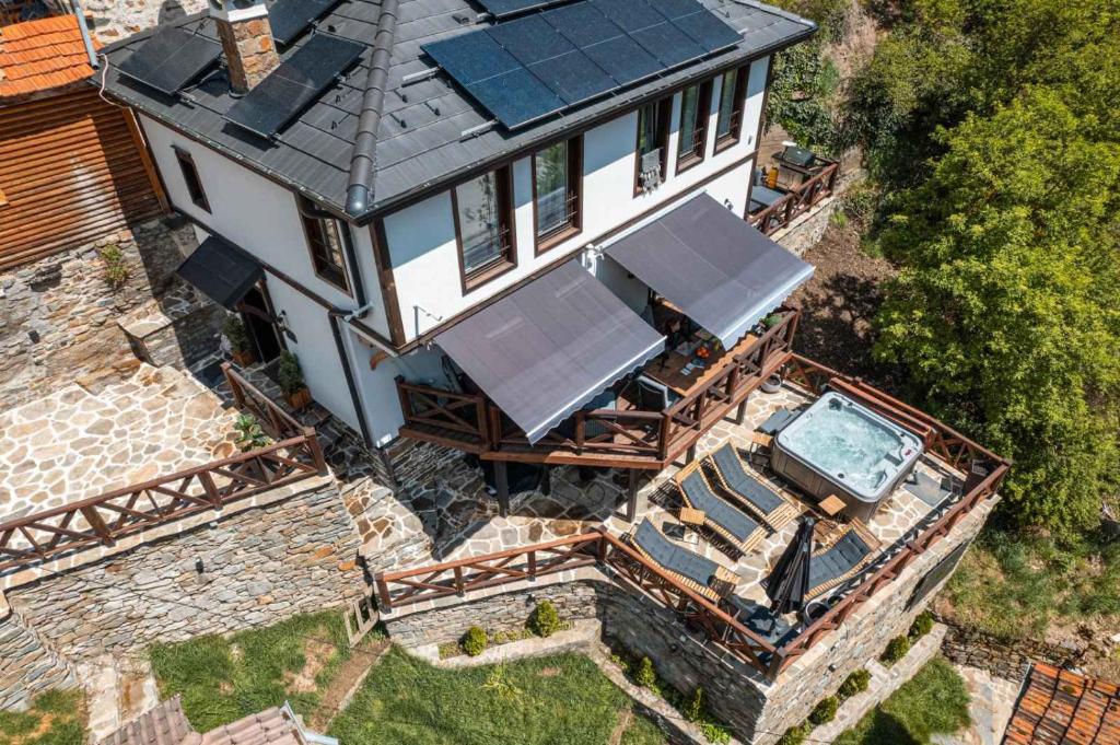 an overhead view of a house with solar panels on it at Spa Villa Mezinska Jacuzzi Sauna in Shiroka Lŭka