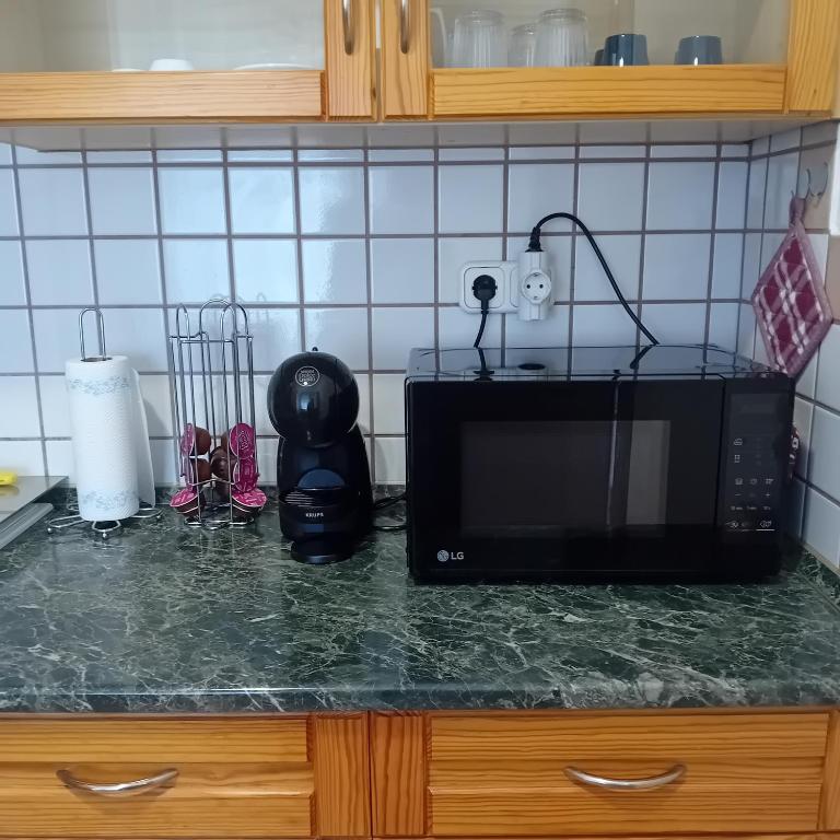 Kuchyň nebo kuchyňský kout v ubytování Kertész14 Apartman