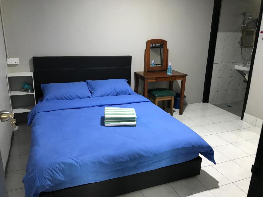 Postel nebo postele na pokoji v ubytování AmanCin by Aman homestay