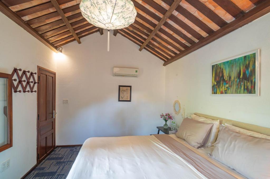 Postel nebo postele na pokoji v ubytování Aloha Hoi An Homestay