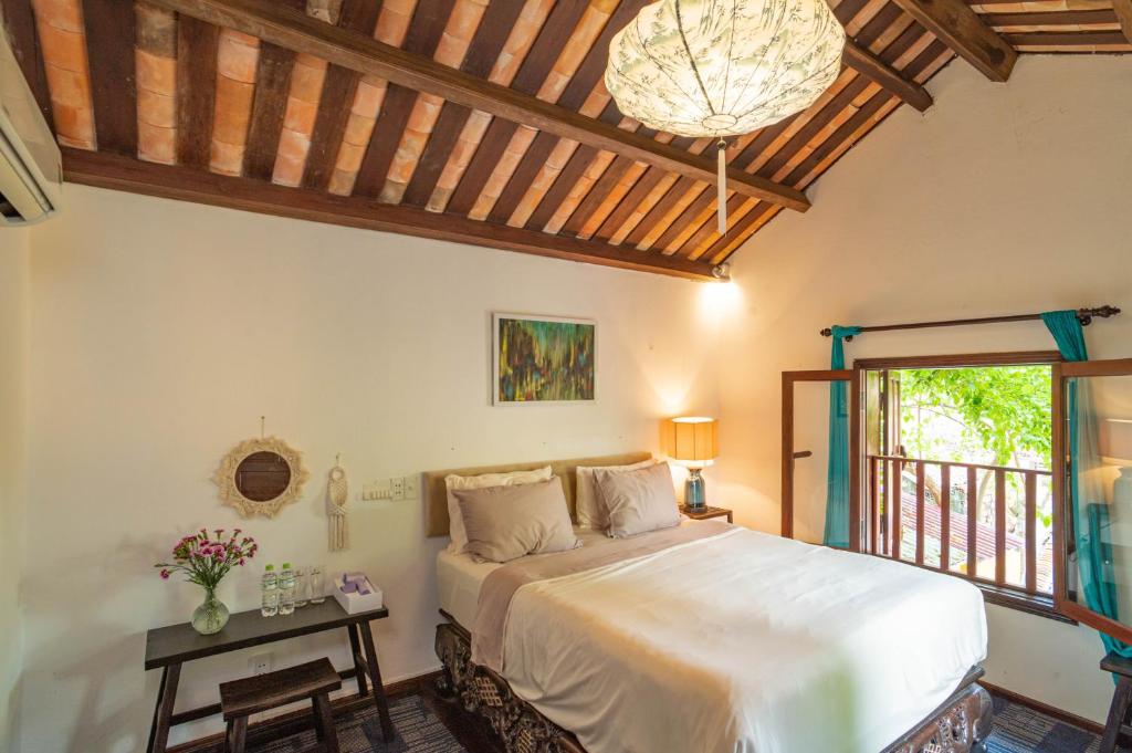 Postel nebo postele na pokoji v ubytování Aloha Hoi An Homestay