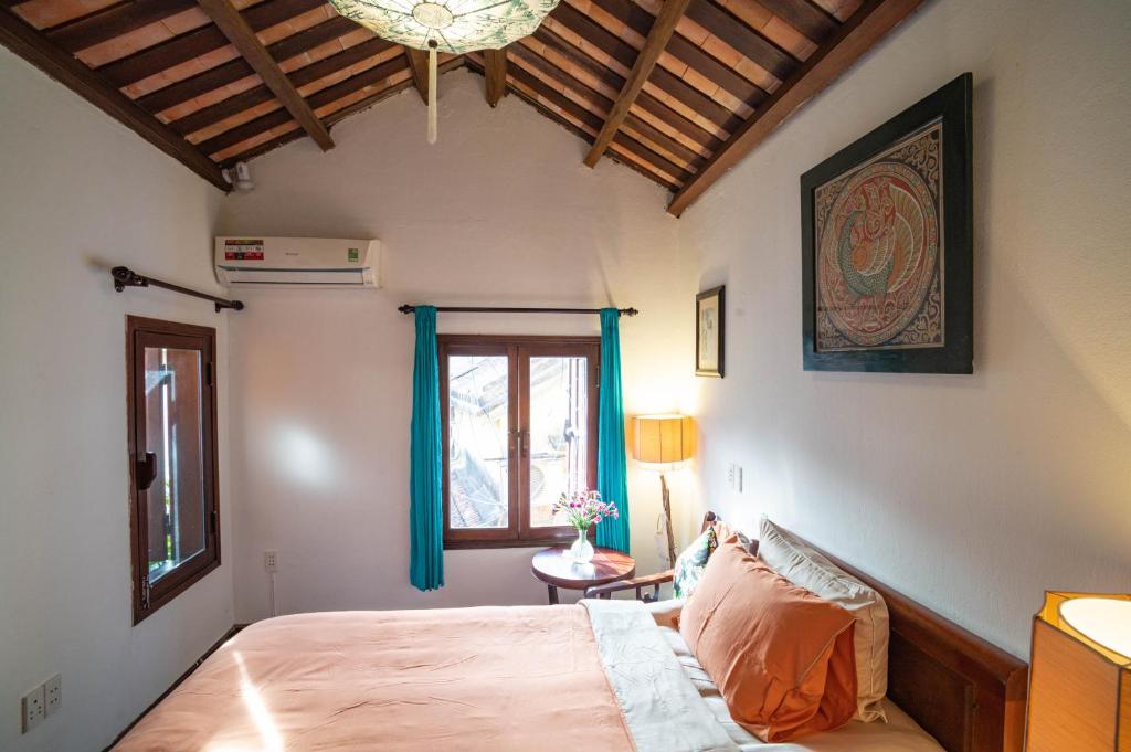 Postel nebo postele na pokoji v ubytování Aloha Hoi An Homestay