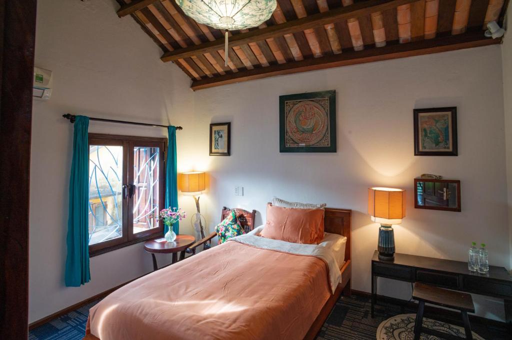 Postel nebo postele na pokoji v ubytování Aloha Hoi An Homestay