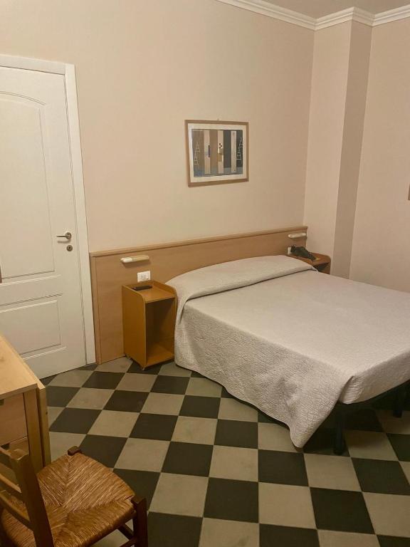 Postel nebo postele na pokoji v ubytování Hotel Florenz