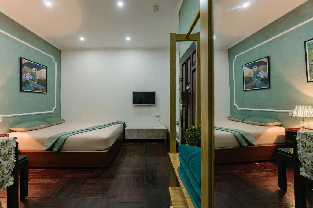 Postel nebo postele na pokoji v ubytování Legume House - 50m to Hoan Kiem lake