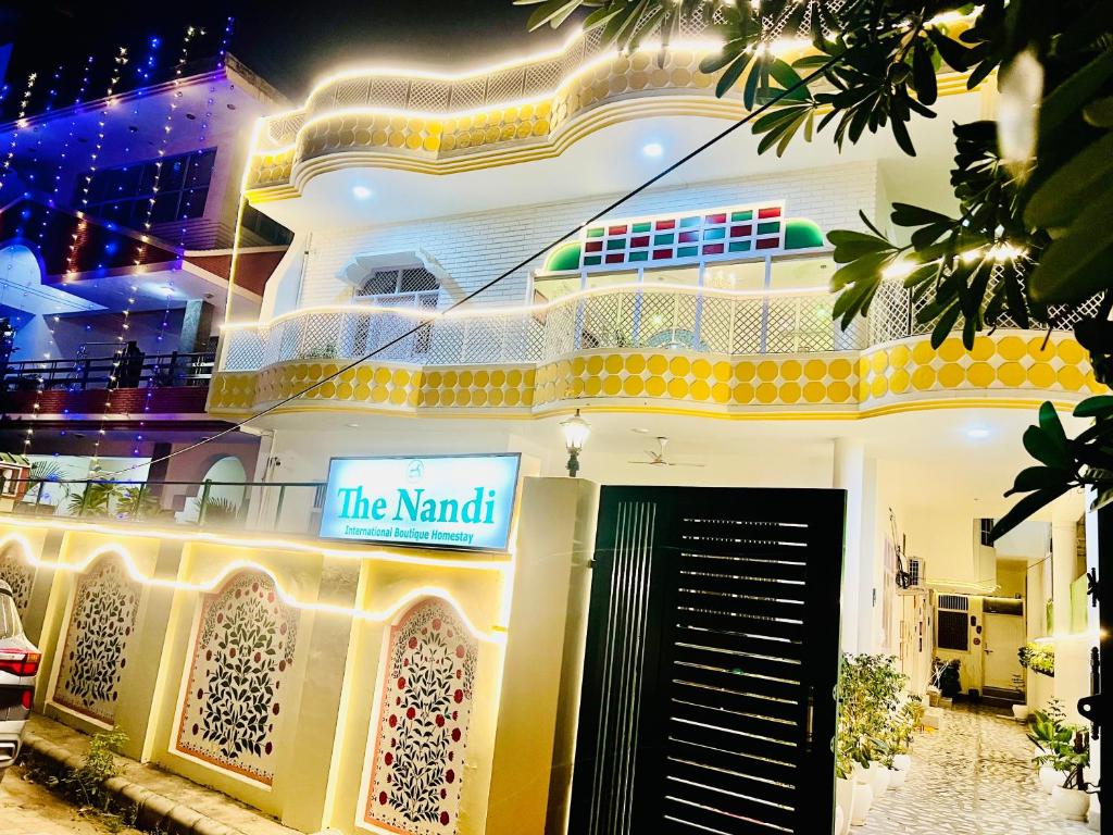 a building with a sign that reads the maid at The Nandi International Boutique Stay in Varanasi