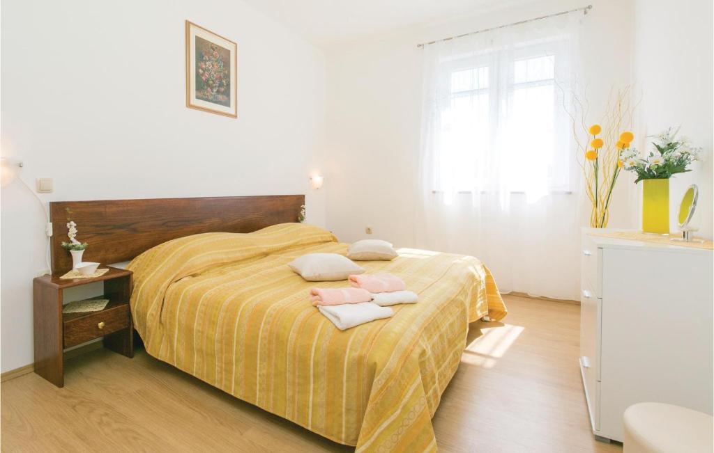Łóżko lub łóżka w pokoju w obiekcie Apartment Labin Kapelica Iii