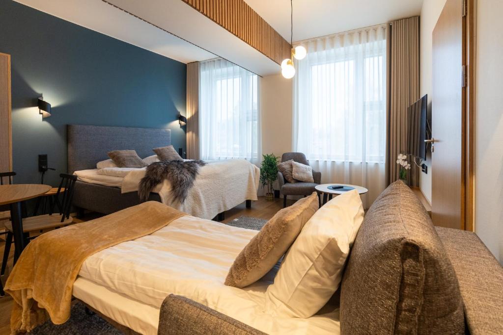 Vuode tai vuoteita majoituspaikassa Postmaster Hotel