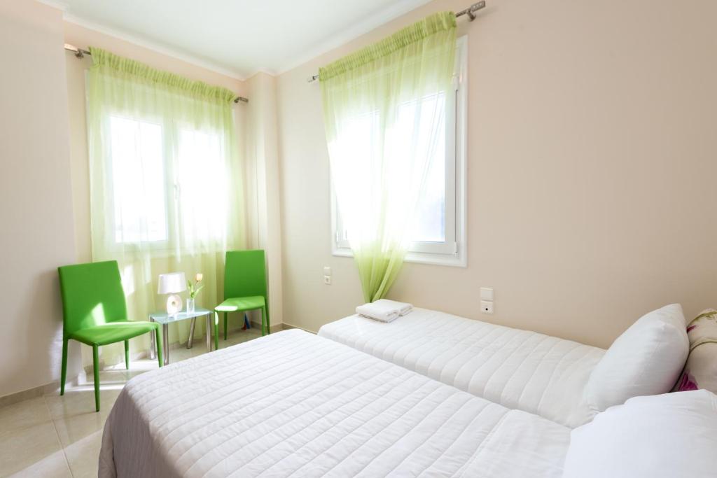 Posteľ alebo postele v izbe v ubytovaní Kronos Villas