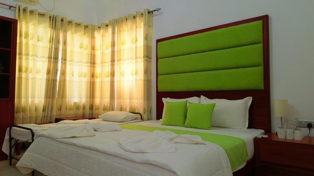 Postel nebo postele na pokoji v ubytování Cogent Holiday Home