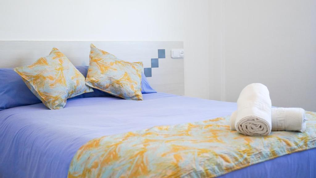 A bed or beds in a room at APARTAMENT LO COR DEL DELTA