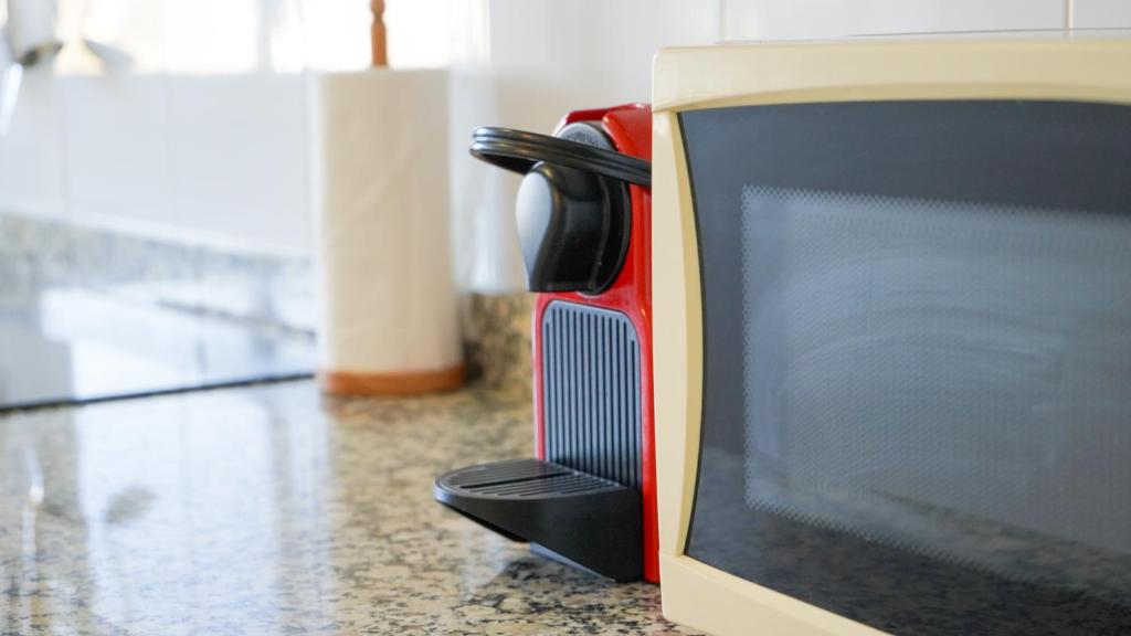 A television and/or entertainment centre at APARTAMENT LO COR DEL DELTA