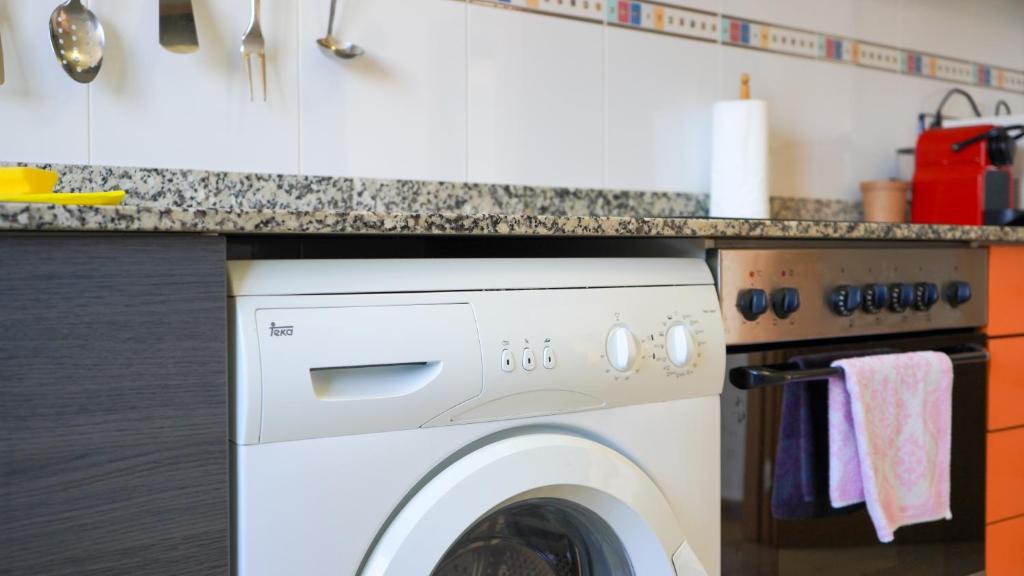 A kitchen or kitchenette at APARTAMENT LO COR DEL DELTA
