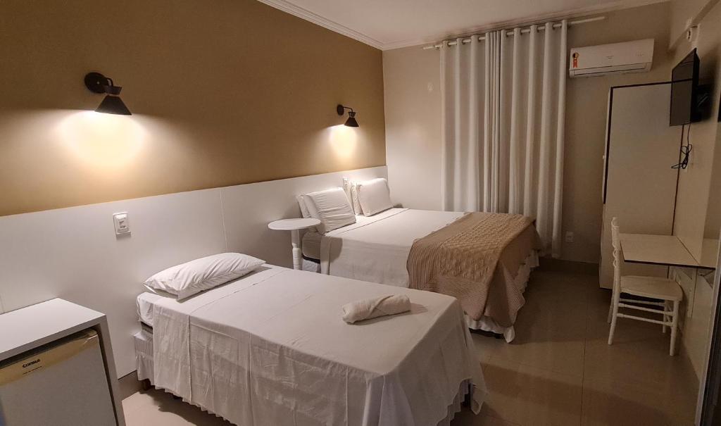 Postel nebo postele na pokoji v ubytování Faixa Hotel