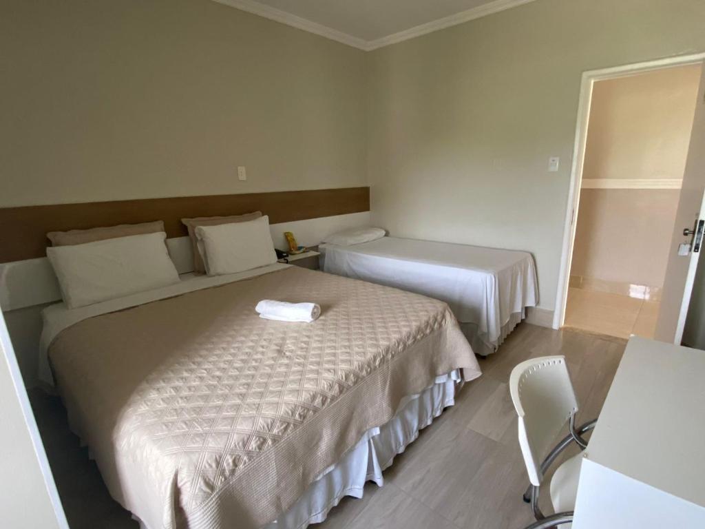 Postel nebo postele na pokoji v ubytování Faixa Hotel