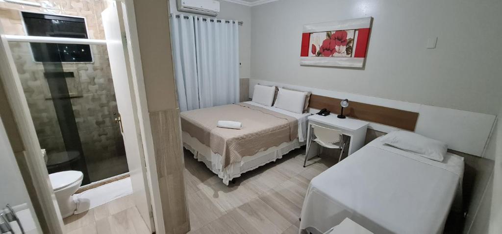 Postel nebo postele na pokoji v ubytování Faixa Hotel