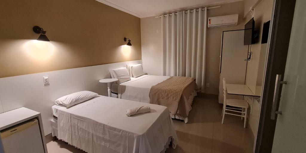 Postel nebo postele na pokoji v ubytování Faixa Hotel