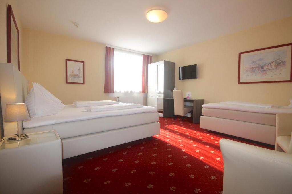 Postel nebo postele na pokoji v ubytování Hotel Altmann