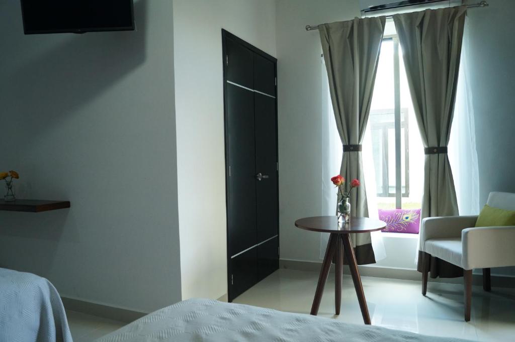 Postel nebo postele na pokoji v ubytování Hotel Casa Palomino