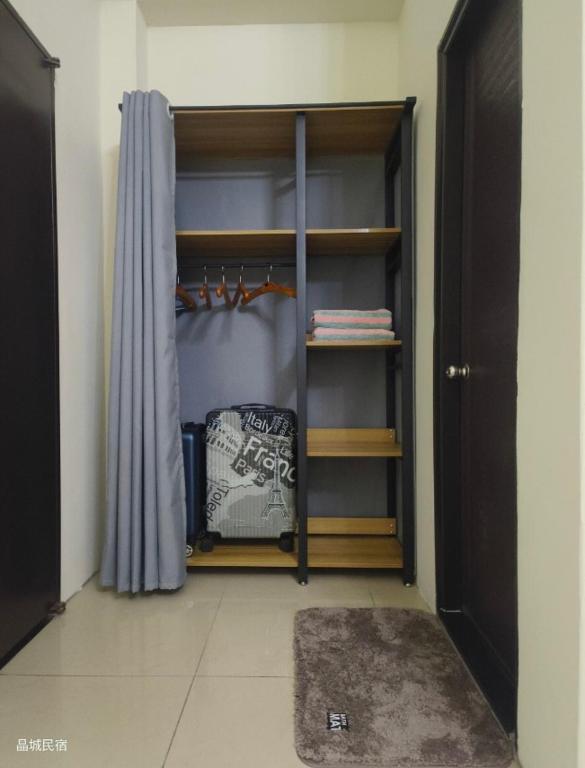 Postel nebo postele na pokoji v ubytování Jing Cheng Homestay