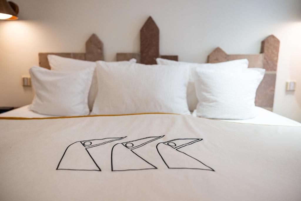Postel nebo postele na pokoji v ubytování Hotel Drei Raben