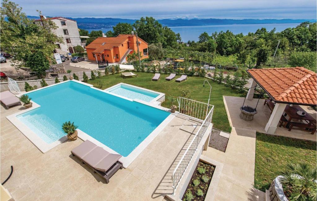 an overhead view of a swimming pool in a backyard at Awesome Home In Lovran With Sauna in Lovran