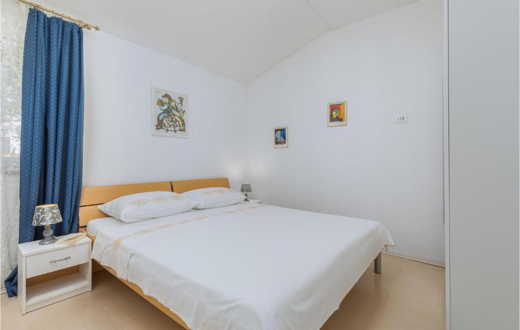 Postel nebo postele na pokoji v ubytování Two-Bedroom Holiday Home In Fazana