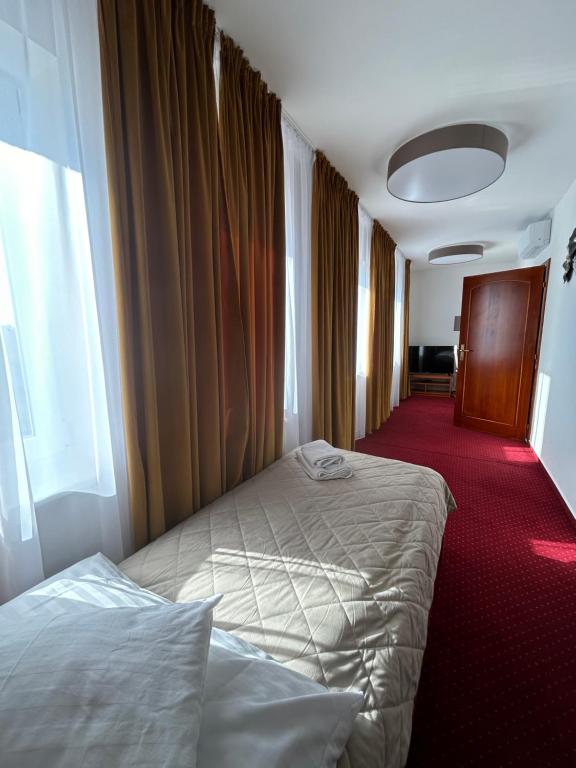 Postel nebo postele na pokoji v ubytování Hotel Evan u Hoffera