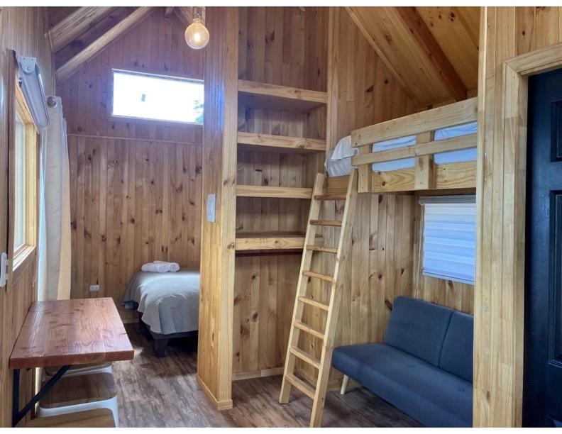 Postel nebo postele na pokoji v ubytování Terra Luna Lodge