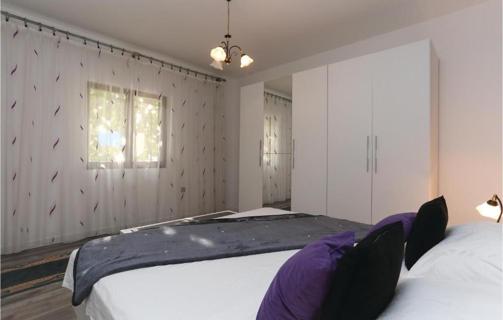 Postel nebo postele na pokoji v ubytování Holiday Home Gata Ostrvica